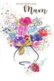 This expressive Mother's Day card shows a vibrant, watercolour bouquet that seems to bloom straight out of the paper, like a fresh arrangement inspired by gardens around Catford and Lewisham. In the centre, bold strokes of cerise, fuchsia, and rich magenta form generous blossoms that echo the shape of open roses and peonies, their petals outlined with confident indigo lines that swirl and curve. Softer blush pinks and touches of apricot nestle beside them, adding depth and tenderness, while small dabs of cool blue and lavender weave through the cluster, bringing a sense of calm and balance, like a cool breeze over nearby Mountsfield Park. The flowers gather in an informal, hand-tied style, not stiff or symmetrical but beautifully relaxed, as though a florist has let their brush wander the way their hands would over real stems. Threaded throughout are delicate glimmers of gold, tracing certain petals, kissing the tips of leaves, and accenting the gentle curve of the vase below. These golden details shimmer softly, suggesting the warmth of afternoon light and the quiet luxury of a thoughtfully finished bouquet. Scattered around the main arrangement, tiny heart motifs and joyful paint splatters dance across the clean white background, evoking scattered petals and the happy chaos of family memories. The vase itself is stylised and rounded, adorned with a fine golden bow that hints at a lovingly wrapped gift, ready to be handed over on the doorstep in Catford. Overall, the card radiates warmth, gratitude, and the intimate connection between mother and child, captured in colour, gesture, and the easy elegance of a florist's artistic touch.